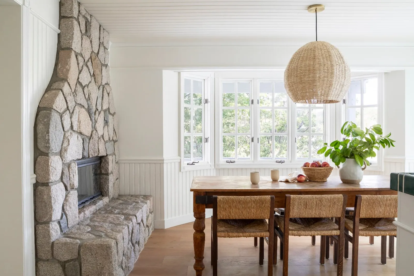 Dining by the stone fireplace